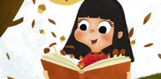 Nena cun libro aberto sobre o que caen follas dunha árbore en Outono